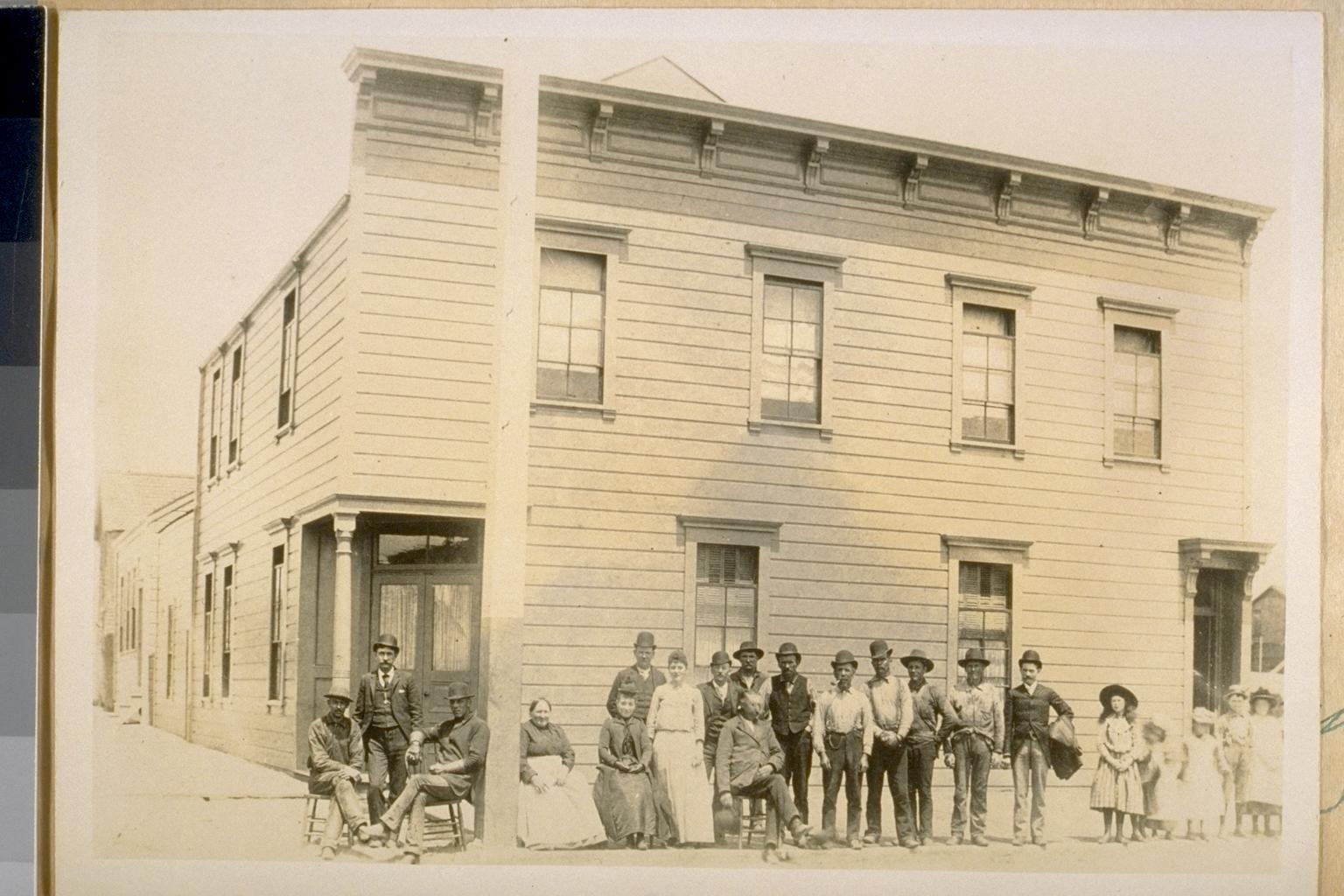 Hotel building with people in front