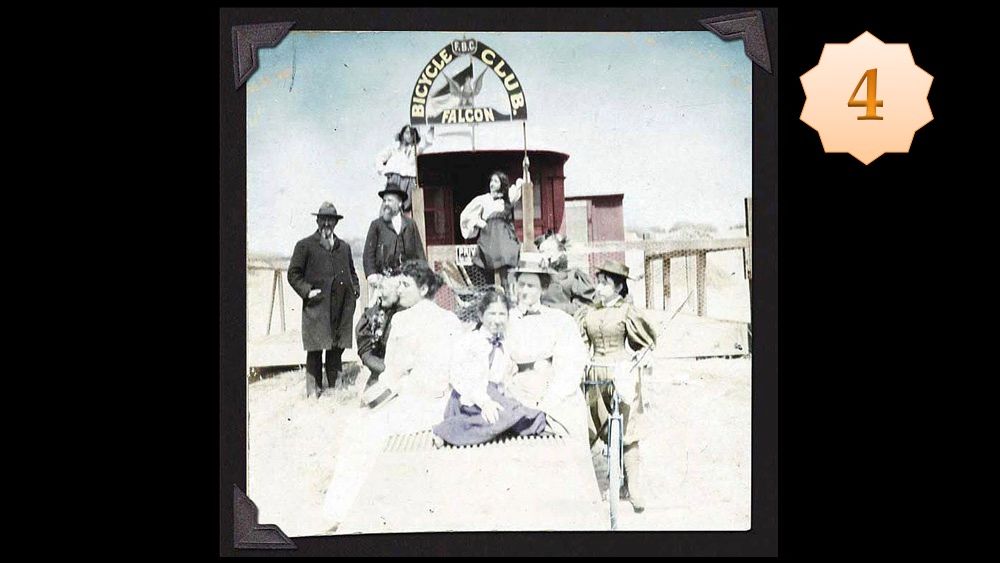 Women with bicycles in front of streetcar house