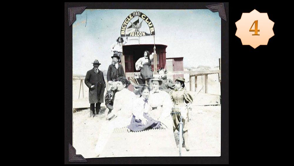 Women with bicycles in front of streetcar house