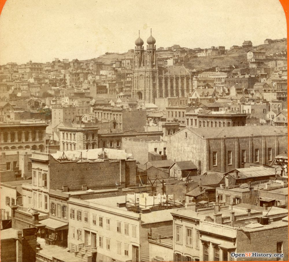 View across city buildings to temple