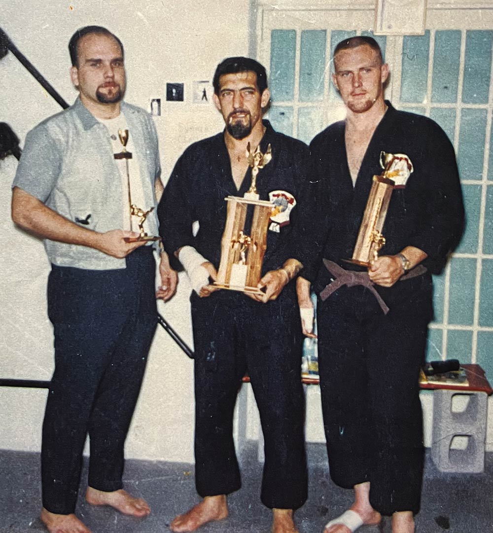 Men with karate trophies
