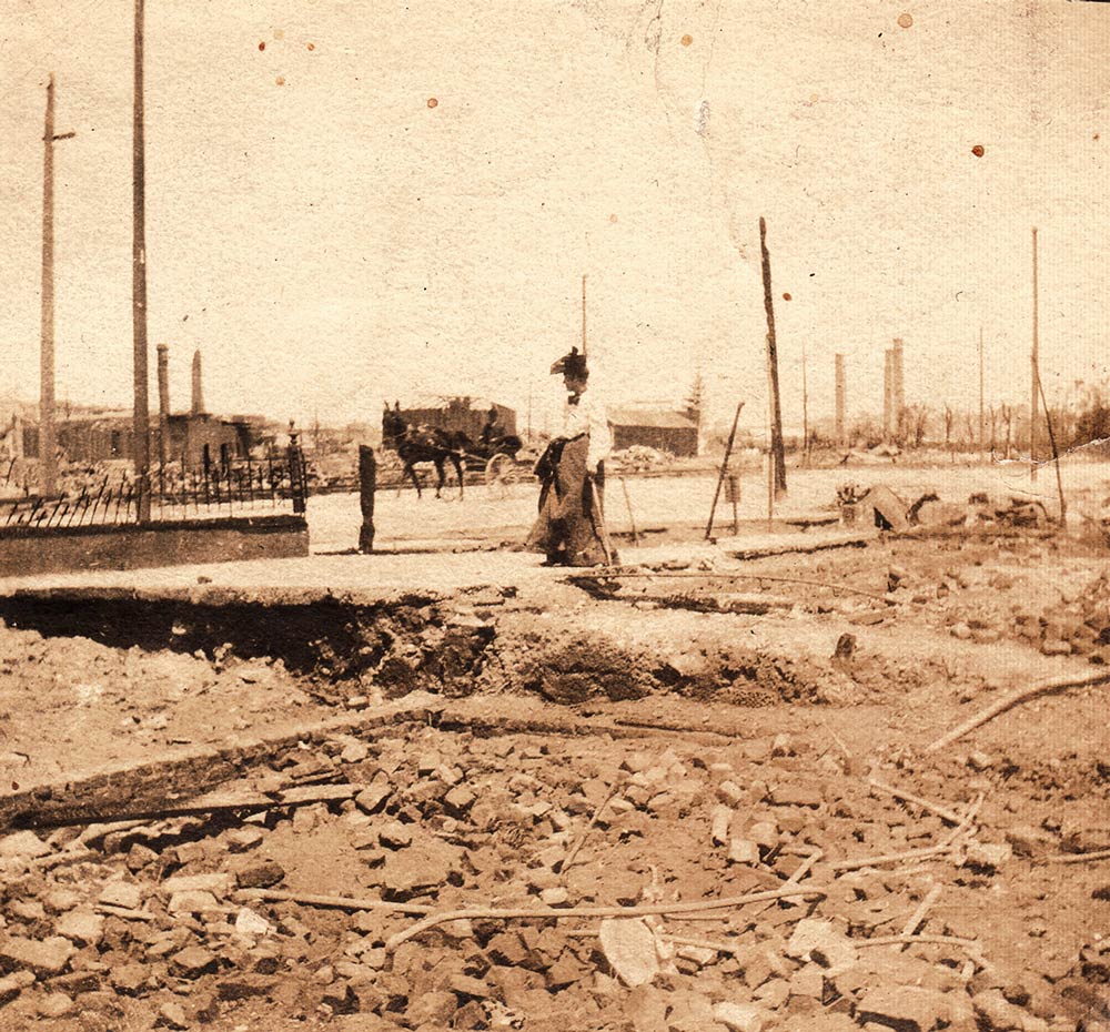 woman and rubble