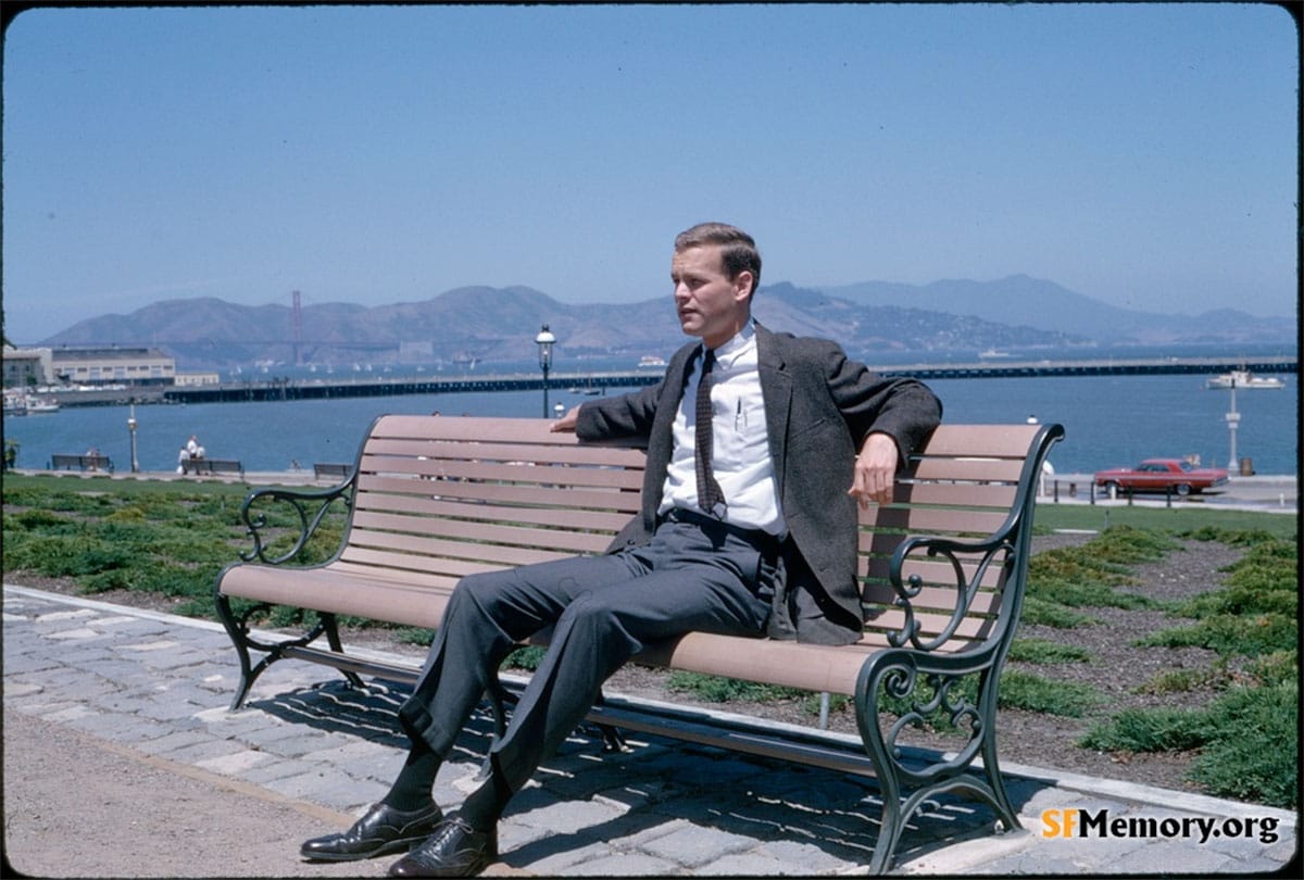 man on bench doing nothing