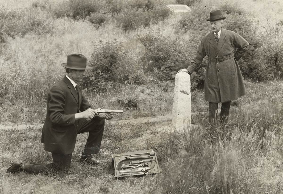 Men with dueling pistols at duel site